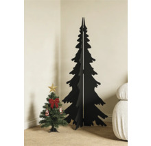 Sapin de Noël minimaliste noir en bois à côté d'un petit sapin artificiel décoré dans le coin d'une pièce lumineuse.