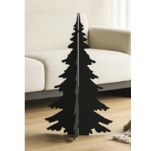 Silhouette de sapin de Noël moderne en métal noir dans un salon lumineux sur un parquet devant un canapé beige.