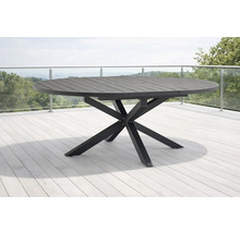 Table de jardin ronde en métal avec plateau à lattes et piètement en étoile sur une terrasse.