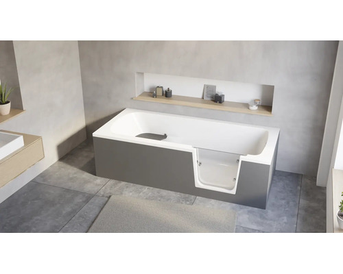 Baignoire moderne avec porte d accès intégrée et insert en verre dans une salle de bain au design minimaliste avec niche murale.
