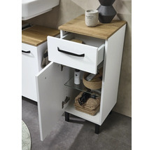 Meuble bas de salle de bain blanc avec plateau aspect bois, un tiroir et une porte avec poignées noires.