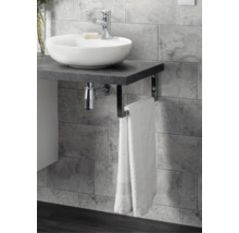 Plan de toilette avec vasque à poser, robinetterie et porte-serviettes intégré devant un mur en carrelage gris.