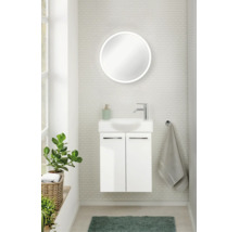 WC d'invités moderne avec meuble sous-vasque suspendu blanc, petite vasque, robinetterie chromée et miroir LED rond.