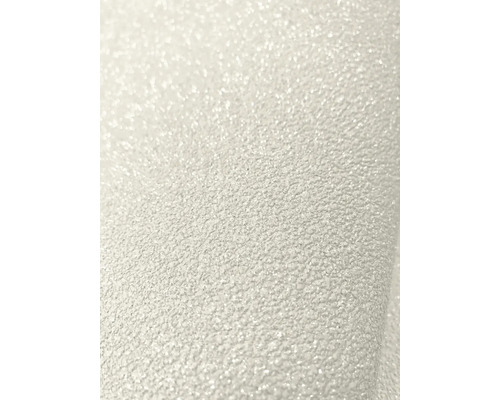 Gros plan d'un papier peint intissé structuré avec une surface granuleuse fine et des effets de paillettes.