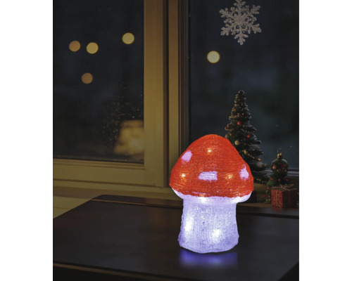 Champignon décoratif LED illuminé en acrylique sur une table, décoration de fenêtre de Noël en arrière-plan.