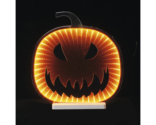 Citrouille d Halloween LED avec effet de miroir infini et visage de Jack-O-Lantern sur socle blanc.