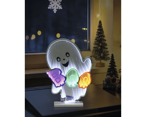 Décoration LED Halloween fantôme avec effet miroir infini et inscription BOO en couleurs, posée sur une table dans une pièce décorée.
