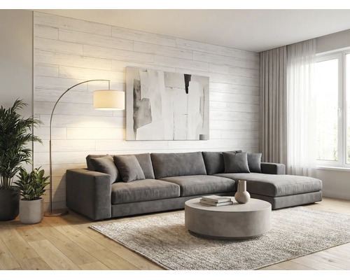 Salon lumineux avec canapé d'angle gris, table basse ronde, lampadaire arqué et mur en bois blanc. Style moderne avec parquet et tapis.