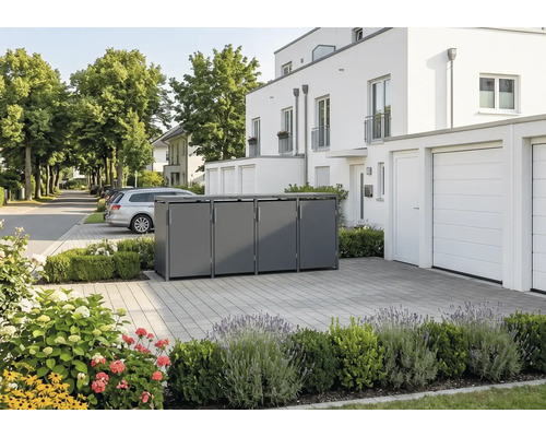 Abri pour quatre poubelles moderne en métal dans une allée pavée devant une maison blanche avec des plantations.