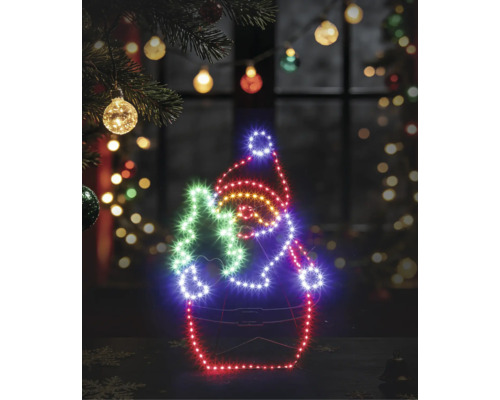 Silhouette LED lumineuse d'un Père Noël avec sapin sur un cadre en fil de fer dans un décor de Noël festif.