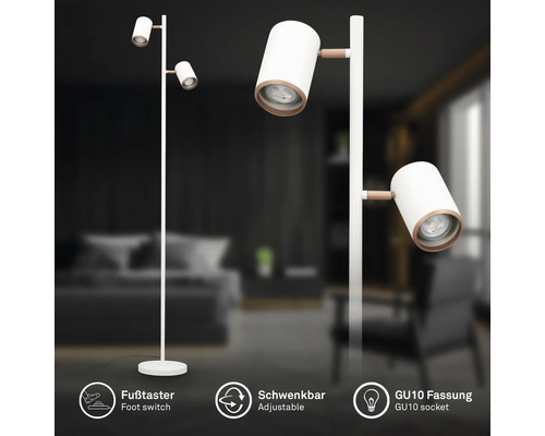 Lampadaire moderne avec deux spots GU10 orientables, interrupteur au pied et cadre en métal blanc avec détails en bois.