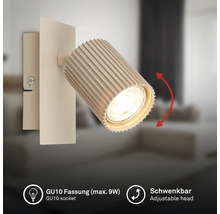 Applique murale avec tête pivotante striée et douille GU10 pour ampoule de maximum 9 Watts.