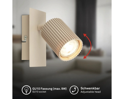Applique murale avec tête pivotante striée et douille GU10 pour ampoule de maximum 9 Watts.