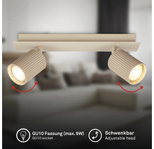 Plafonnier à deux spots avec têtes nervurées, douille GU10 pour 9 watts maximum et têtes de lampe orientables.