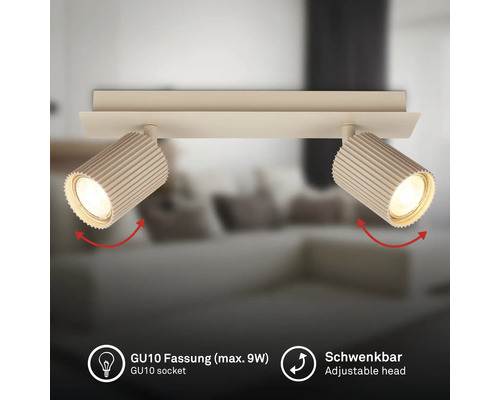 Plafonnier à deux spots avec têtes nervurées, douille GU10 pour 9 watts maximum et têtes de lampe orientables.