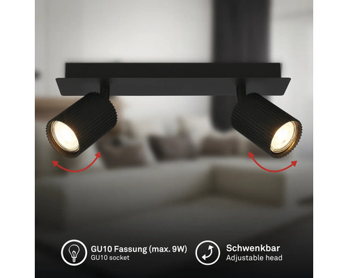 Plafonnier noir à deux spots avec têtes rainurées orientables et douille GU10 pour un maximum de 9 Watts.