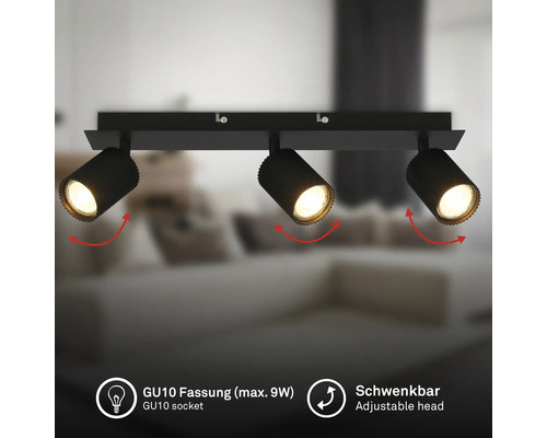 Plafonnier à 3 spots noirs avec têtes orientables et douilles GU10 pour un maximum de 9 Watts, dans un espace de vie moderne.