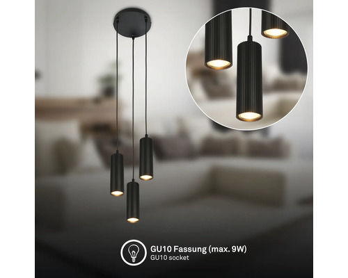 Suspension noire à trois lampes avec abat-jour cylindriques nervurés et douille GU10 pour un maximum de 9 Watt dans un salon lumineux.