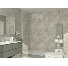 Salle de bains moderne et lumineuse avec douche italienne en verre, carrelage grand format aspect pierre, lavabo avec miroir et radiateur design.