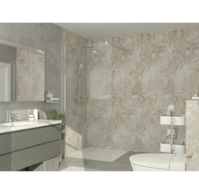 Salle de bain moderne avec douche à l'italienne, paroi en verre, grands carreaux muraux aspect pierre, meuble sous-vasque et miroir.