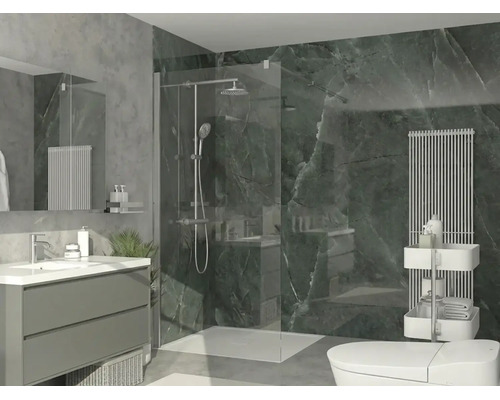 Salle de bains moderne avec douche à l'italienne en verre, meuble sous-lavabo, carrelage mural aspect marbre vert foncé et radiateur vertical.