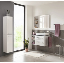 Ensemble de meubles de salle de bain blanc avec meuble sous-vasque, armoire de toilette et colonne dans une pièce lumineuse.