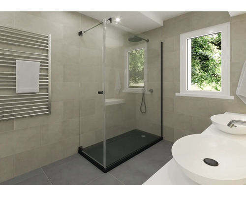 Salle de bains moderne avec une cabine de douche en verre et un receveur de douche sombre, un sèche-serviettes et un double lavabo.