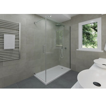 Modernes Badezimmer mit Glas-Duschabtrennung, flacher Duschwanne, Handtuchheizkörper, Doppelwaschtisch und grauen Wandfliesen.