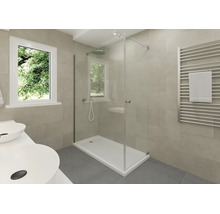 Salle de bain moderne avec douche en verre, receveur blanc, radiateur sèche-serviettes et double vasque devant un carrelage beige.