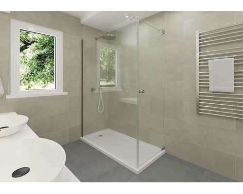 Salle de bain moderne avec douche en verre, receveur blanc, radiateur sèche-serviettes et double vasque devant un carrelage beige.