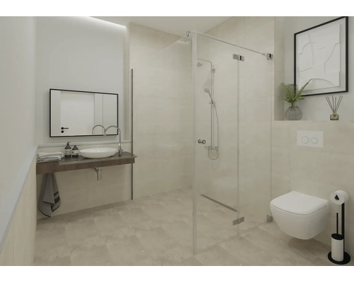 Salle de bains moderne et lumineuse avec cabine de douche en verre, WC suspendu, lavabo à poser et grand miroir mural.