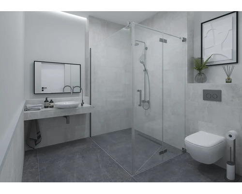 Modernes Badezimmer mit Glas-Duschkabine, wandhängendem Waschtisch mit Aufsatzbecken, Spiegel und Hänge-WC. Graue Fliesen an Wand und Boden.