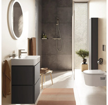 Salle de bains moderne avec meuble gris foncé, vasque blanche, miroir rond, douche à l'italienne et WC suspendu. Ambiance lumineuse et organisée.