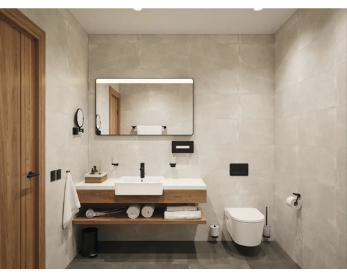 Salle de bains moderne avec meuble sous-vasque en bois, vasque blanche, robinetterie noire, miroir rétroéclairé et WC suspendu sur carrelage clair.