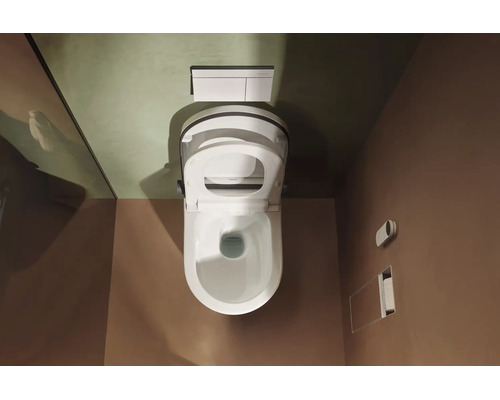Vue de dessus d un WC-douche suspendu moderne en céramique blanche dans une salle de bains minimaliste avec plaque de déclenchement.