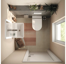 Vue de dessus d'une salle de bains moderne et lumineuse avec lavabo blanc, toilettes suspendues, tapis rayé et lumière naturelle par une fenêtre.