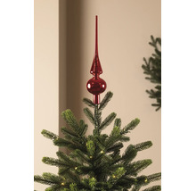 Cimier de sapin de Noël rouge brillant sur un sapin de Noël vert avec de petites lumières.