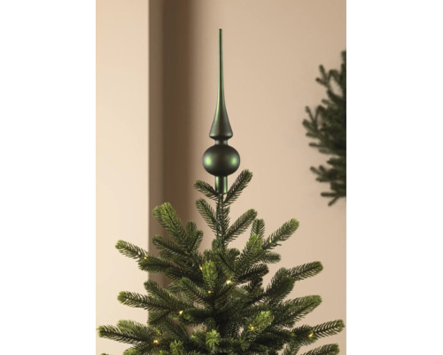 Cimier de sapin vert mat sur un sapin de Noël artificiel avec éclairage.