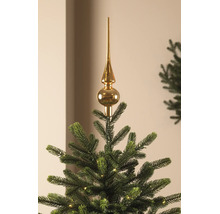 Cimier de sapin de Noël brillant sur un sapin de Noël avec des lumières.
