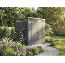Abri de jardin moderne gris foncé avec toit plat et imposte périphérique dans un jardin verdoyant avec fleurs et chemin de gravier.
