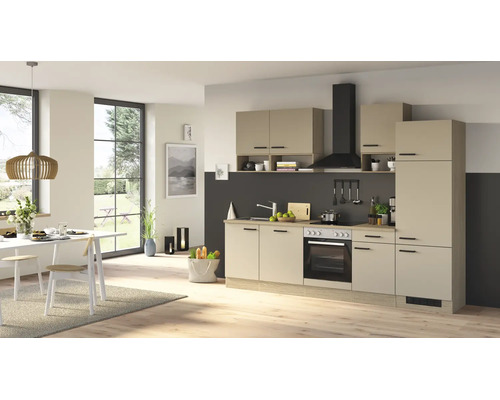 Cuisine intégrée moderne en beige avec appareils noirs et éléments en bois dans un espace de vie et de repas lumineux et ouvert.