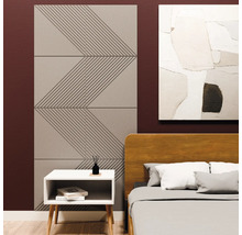 Panneaux acoustiques avec motif géométrique en zigzag sur un mur de chambre à coucher à côté d'un lit et d'une table de nuit.