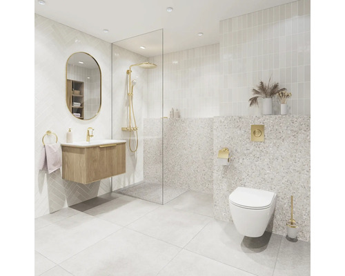 Modernes, helles Badezimmer mat Holz-Waschtisch, ovalem Spigel, Glasdusche a wandhängetem WC. Goldfaarveg Armaturen an Terrazzo-Fliesen.