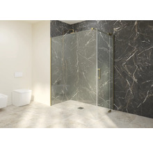 Cabine de douche en verre avec profilés dorés dans une salle de bain moderne avec mur en marbre foncé et douche à l'italienne.