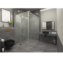 Salle de bains moderne avec cabine de douche en verre et détails dorés, carrelage gris, WC suspendu noir et vasque avec robinet doré.
