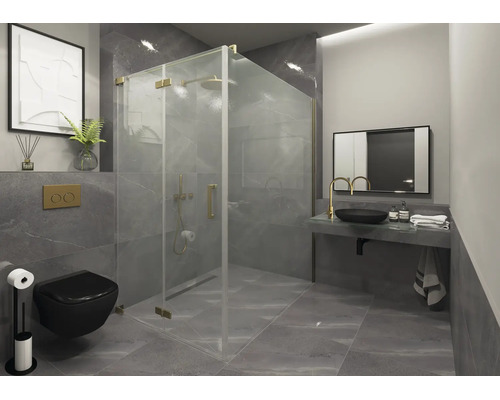 Salle de bains moderne avec cabine de douche en verre et détails dorés, carrelage gris, WC suspendu noir et vasque avec robinet doré.