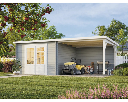 Abri de jardin moderne en bois gris avec double porte blanche et auvent intégré dans un jardin ensoleillé.