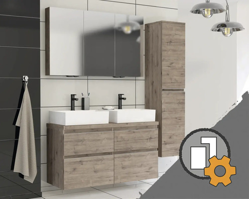 Ensemble de meubles de salle de bain moderne avec double vasque, armoire à miroir et colonne de salle de bain aspect bois devant des murs carrelés.