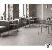 Moderne Gastronomie mit grauen Fliesen in Riffelblechoptik und rauen Natursteinwänden sowie minimalistischen Metallstühlen und Tischen. (Image AI modified or generated)