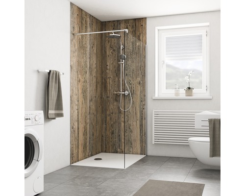 Salle de bains avec douche, lave-linge, toilettes, radiateur et fenêtre